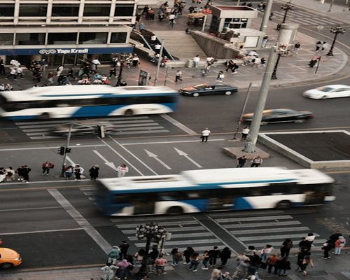 A busy city crosswalk in Valencia illustrating fast-paced urban challenges